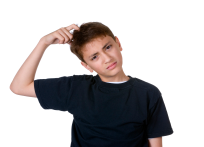 Boy scratching head with quizzical look