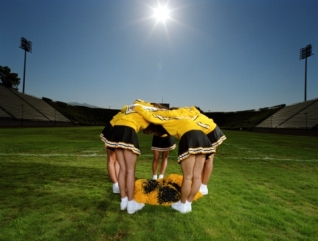 Cheerleaders in huddle
