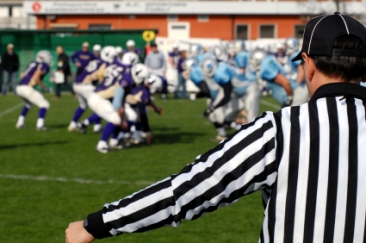 Football official watching action