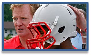 N.F.L. Commissioner Roger Goodell and youth football player