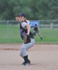 Young pitcher about to deliver to plate