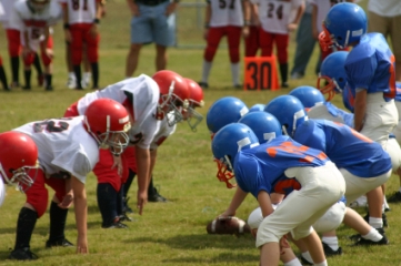 Youth football game at line of scrimmage