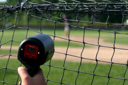 Radar gun pointed at baseball pitcher through screen