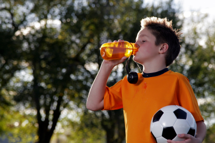 Young soccer player hydrating