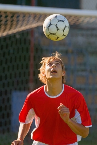 Soccer player heading ball