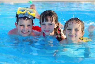 Three kids in a pool