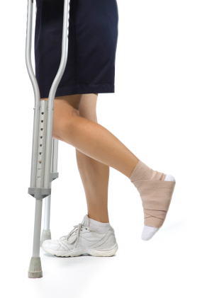 Athlete with injured ankle on crutches