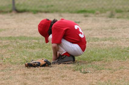 Upset youth baseball player