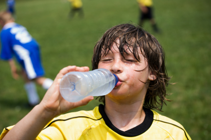 Soccer player drinking from water bottle