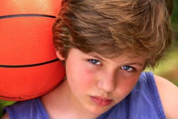 Sad boy with basketball